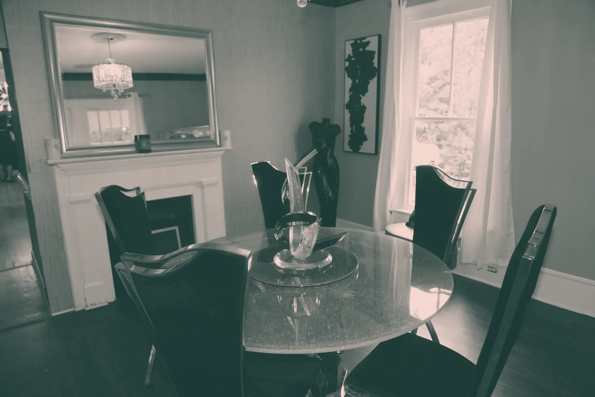 A round glass table in the dining room